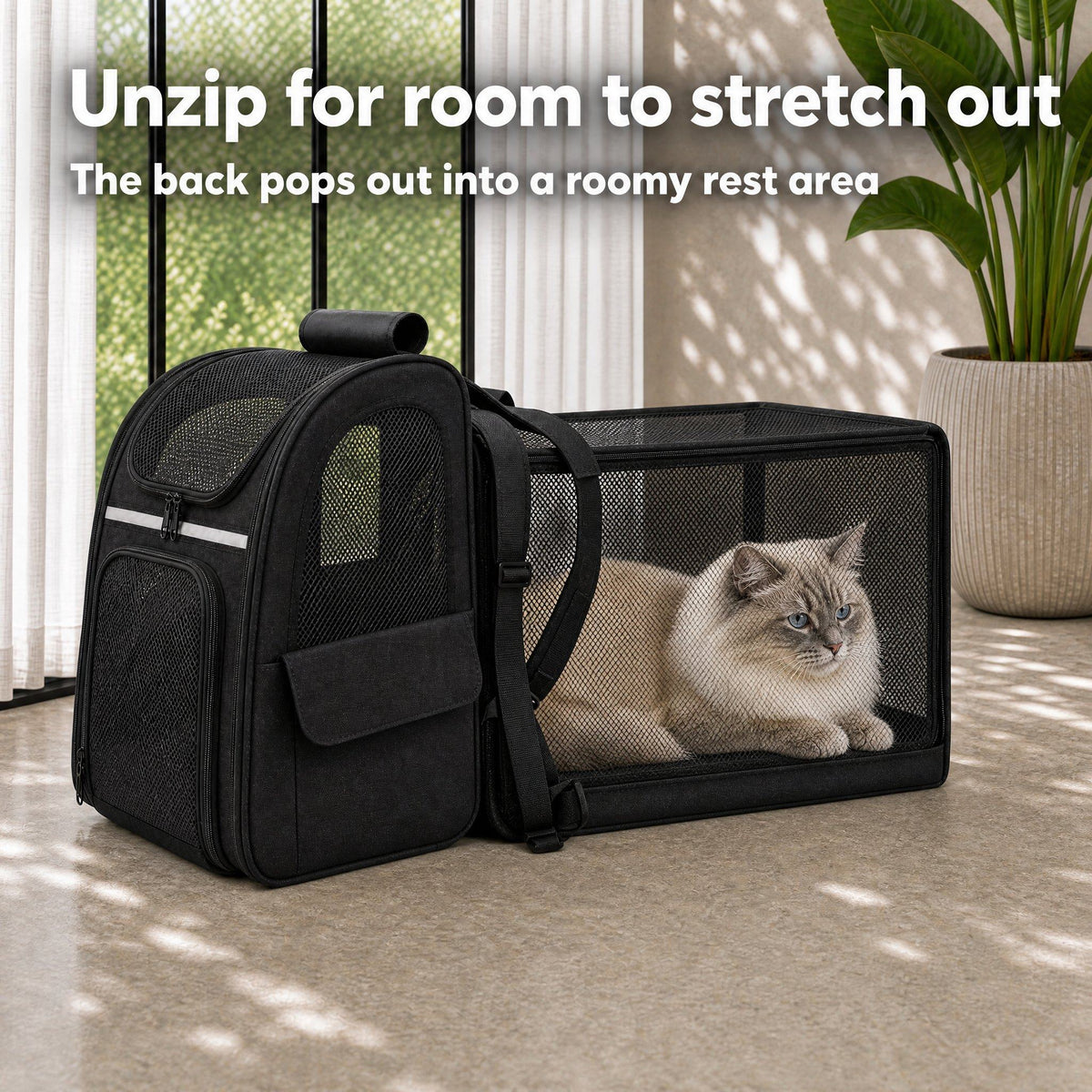 Ragdoll cat lying in the expanded mesh section of the cat carrier